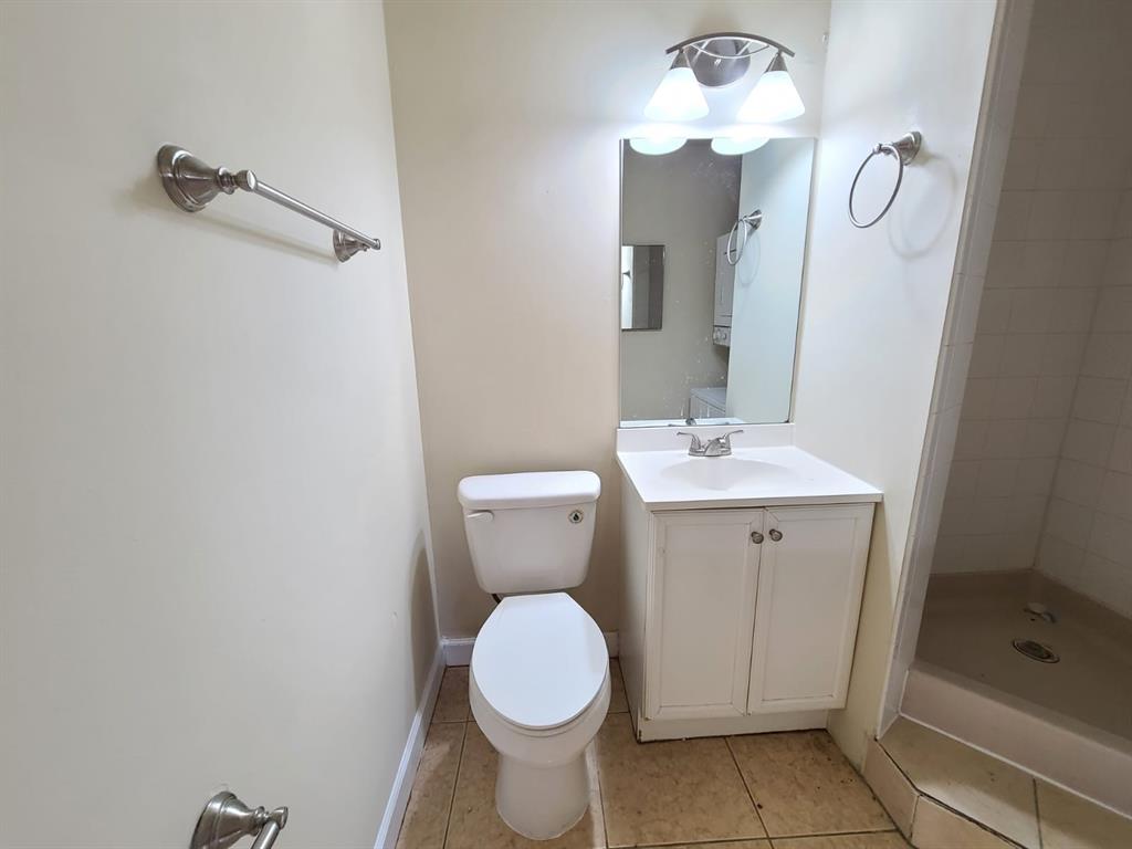 2 Crossings Circle, Unit G Boynton Beach, FL 33435 - Photo 14 of 22 a bathroom with a toilet sink and shower