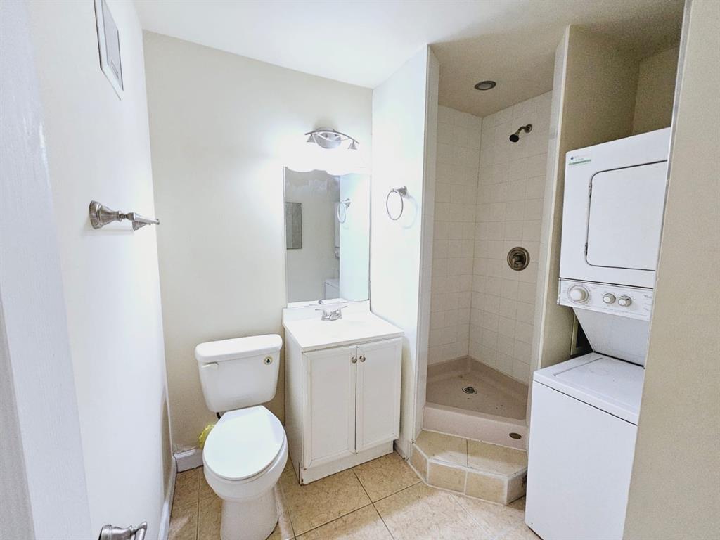 2 Crossings Circle, Unit G Boynton Beach, FL 33435 - Photo 15 of 22 a bathroom with a toilet sink and shower