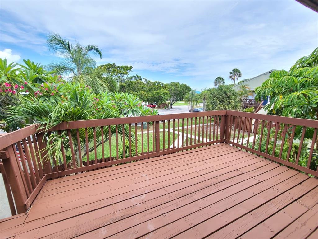 2 Crossings Circle, Unit G Boynton Beach, FL 33435 - Photo 17 of 22 a balcony with wooden floor