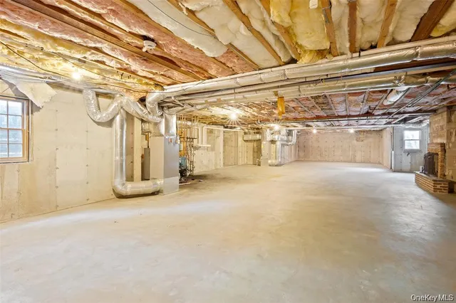a bathroom with a granite countertop sink a toilet and a mirror