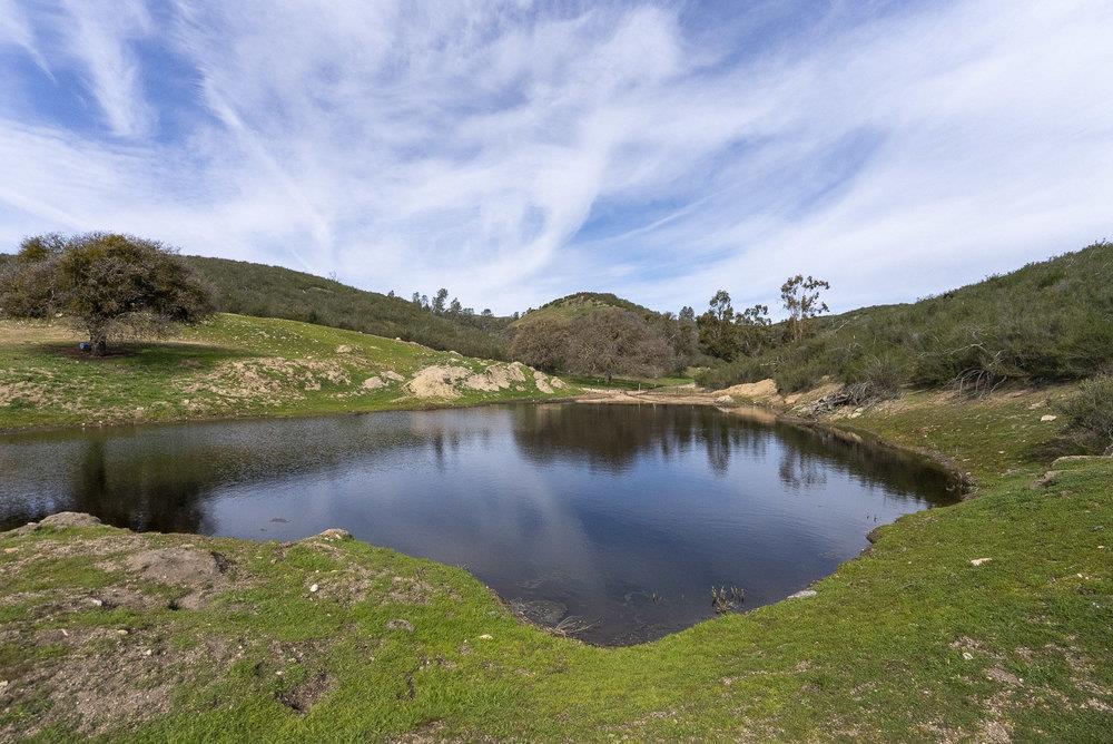 0 Bryant Canyon Road Soledad, CA 93960 - Photo 2 of 73 a view of a lake with a mountain in the background