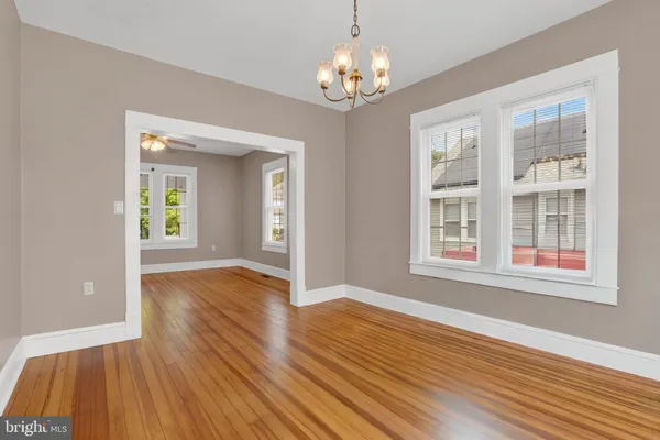 a view of livingroom with natural light and hardwood floor