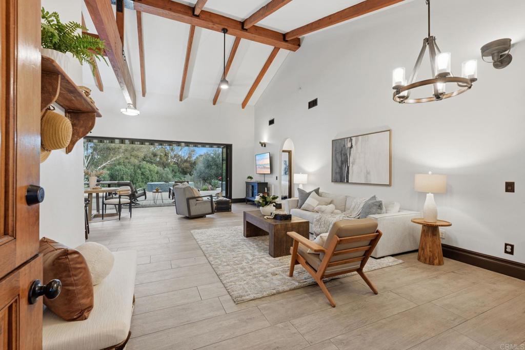 1111 Palomino Road Fallbrook, CA 92028 - Photo 12 of 64 a living room with furniture and a large window