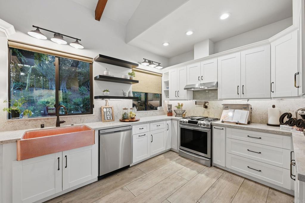 1111 Palomino Road Fallbrook, CA 92028 - Photo 18 of 64 a kitchen with stainless steel appliances granite countertop a sink and cabinets