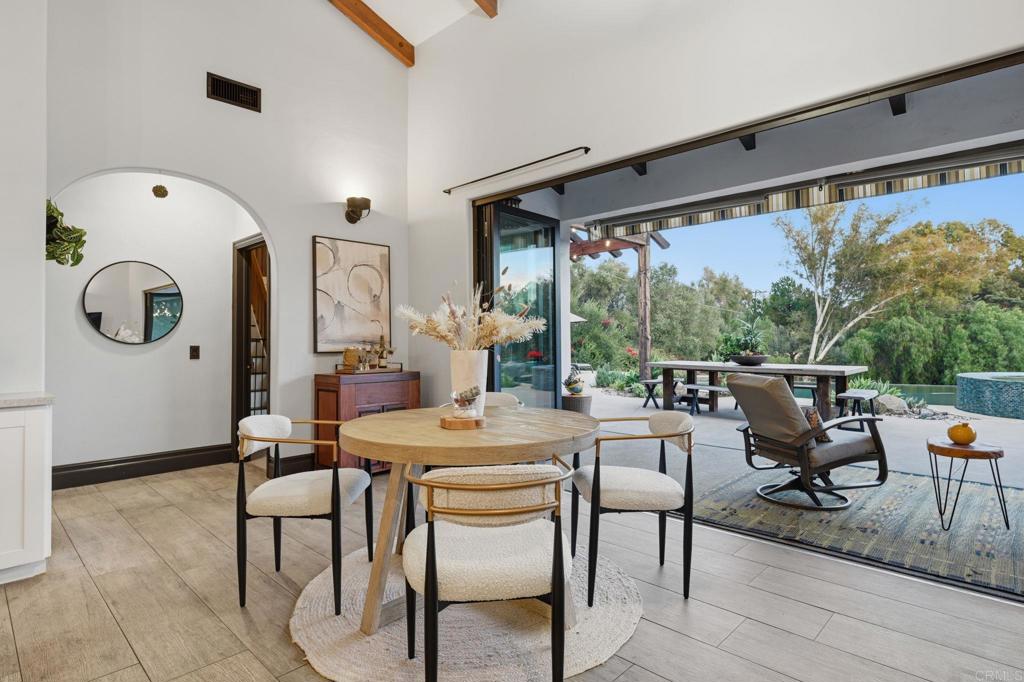 1111 Palomino Road Fallbrook, CA 92028 - Photo 20 of 64 a dining room with furniture and a large window