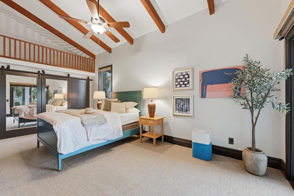 1111 Palomino Road Fallbrook, CA 92028 - Photo 33 of 64 a bedroom with a bed and a potted plant