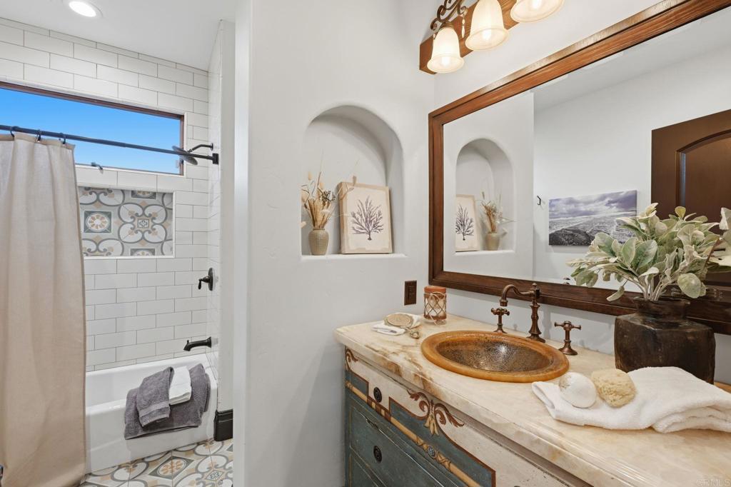 1111 Palomino Road Fallbrook, CA 92028 - Photo 38 of 64 a bathroom with a sink and a mirror