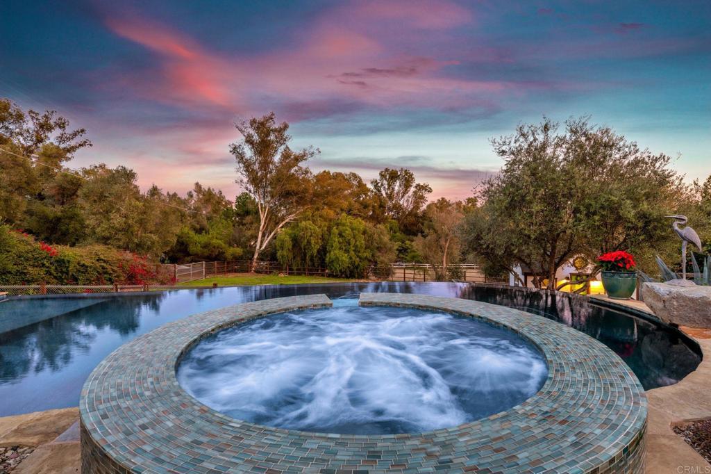 1111 Palomino Road Fallbrook, CA 92028 - Photo 47 of 64 a view of a swimming pool with an outdoor seating