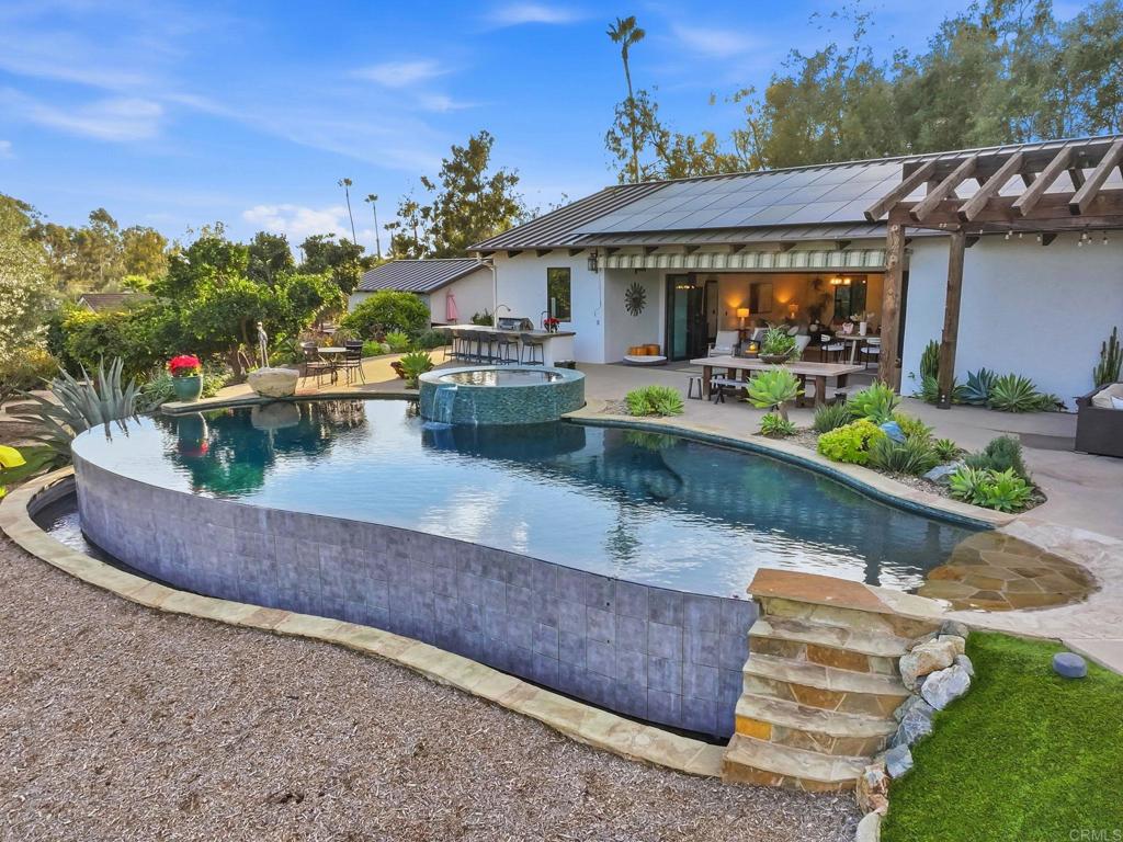 1111 Palomino Road Fallbrook, CA 92028 - Photo 49 of 64 a view of a house with pool and chairs