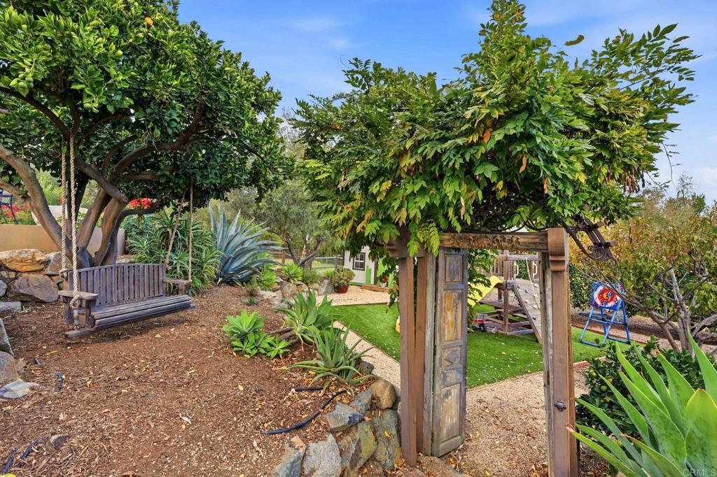 1111 Palomino Road Fallbrook, CA 92028 - Photo 54 of 64 a front view of a house with garden
