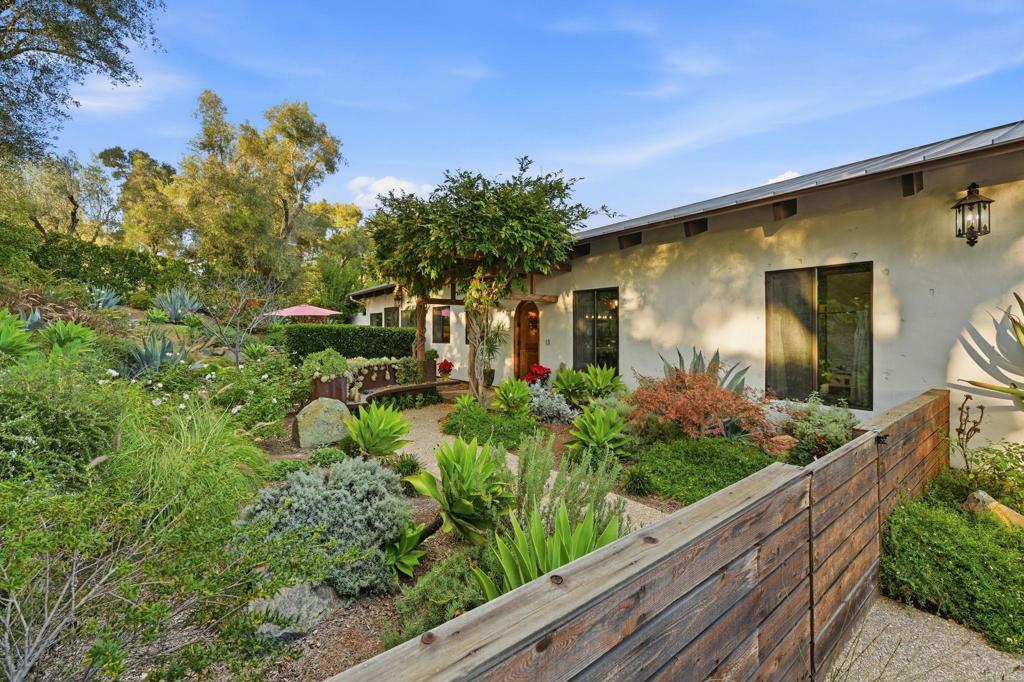 1111 Palomino Road Fallbrook, CA 92028 - Photo 7 of 64 a front view of a house with a yard