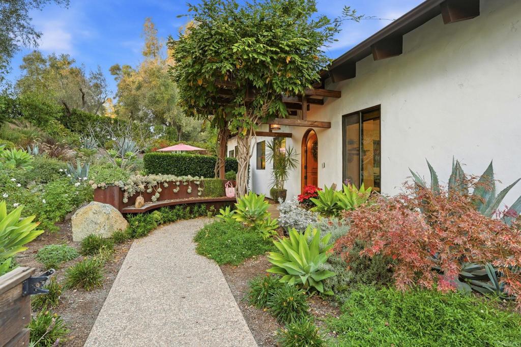 1111 Palomino Road Fallbrook, CA 92028 - Photo 9 of 64 a view of a house with a yard and garden