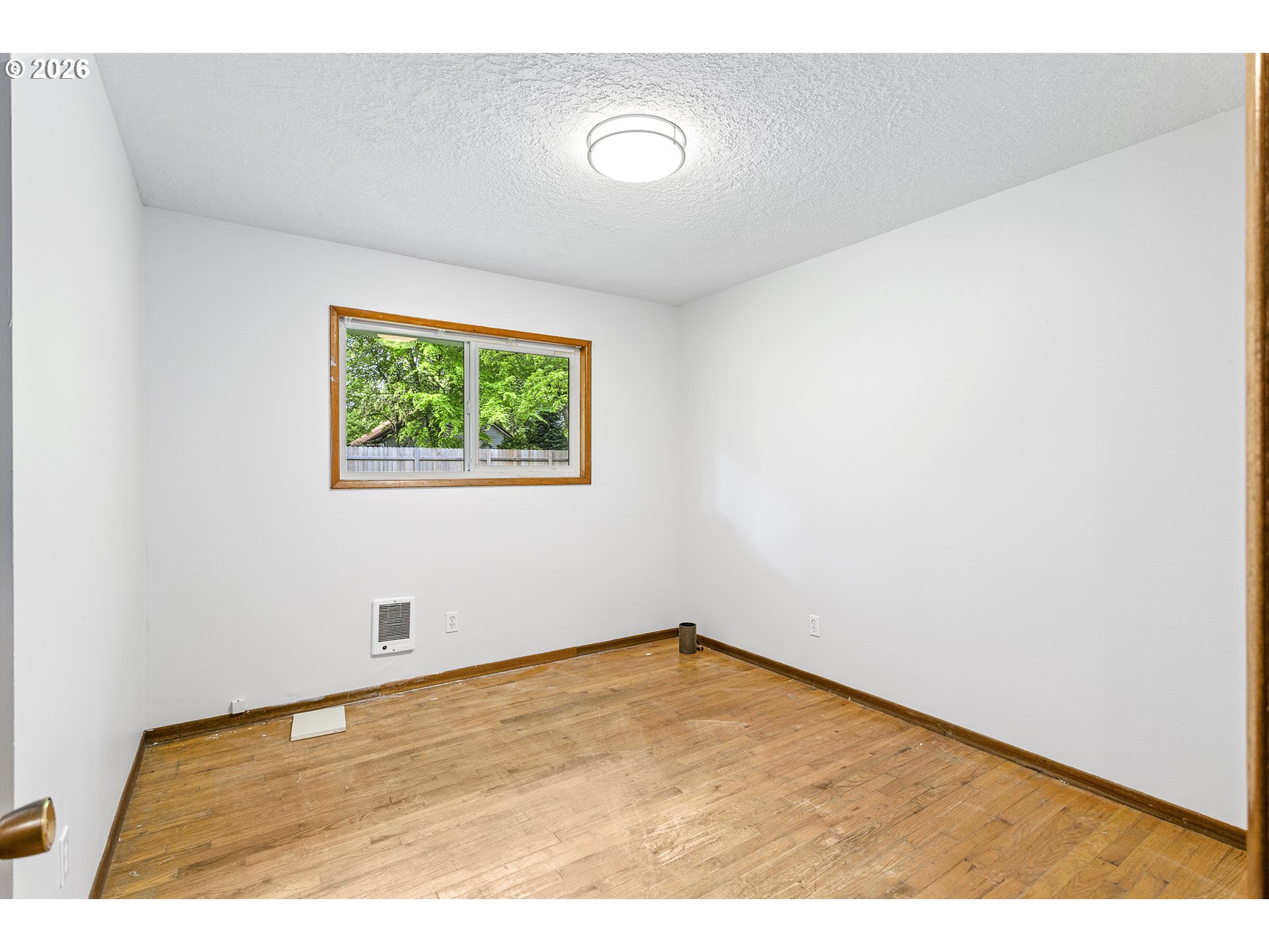 9375 Southwest Killarney Lane Tualatin, OR 97062 - Photo 17 of 25 a view of empty room with wooden floor