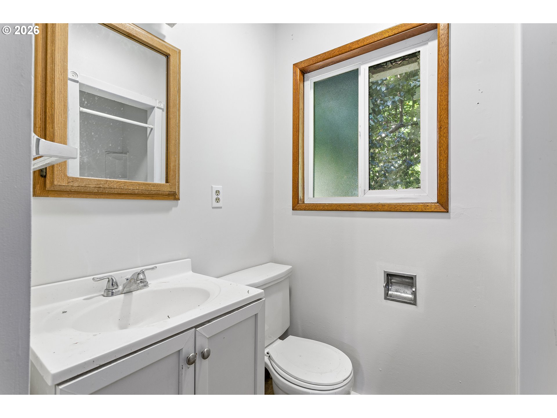9375 Southwest Killarney Lane Tualatin, OR 97062 - Photo 20 of 25 a bathroom with a sink a mirror and a toilet