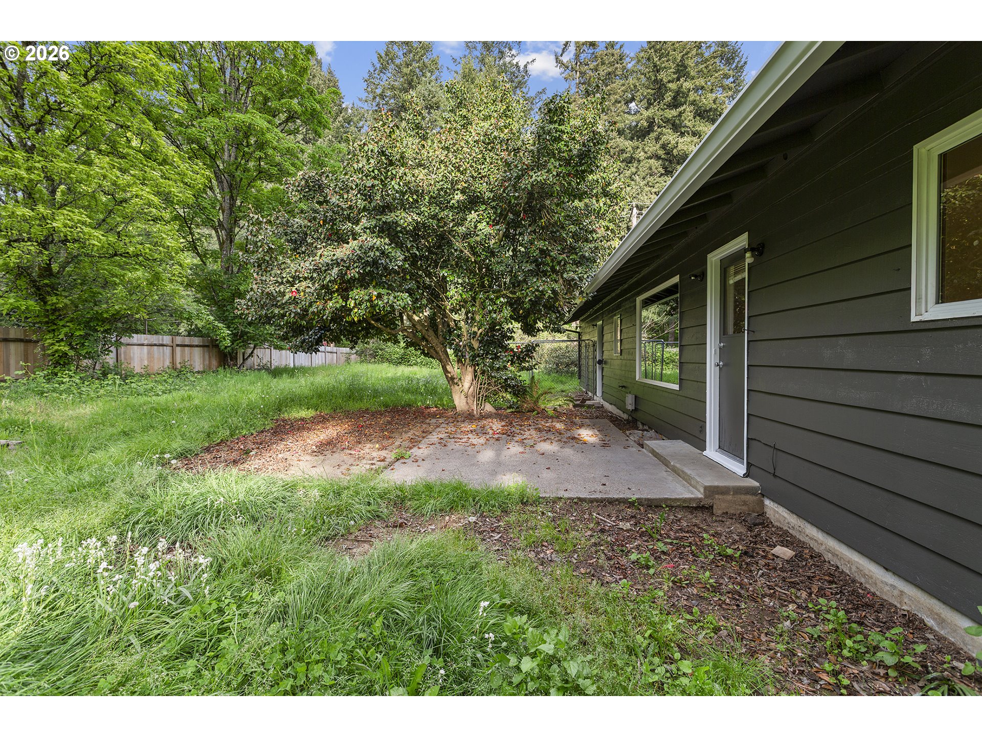 9375 Southwest Killarney Lane Tualatin, OR 97062 - Photo 23 of 25 a view of backyard of house with green space