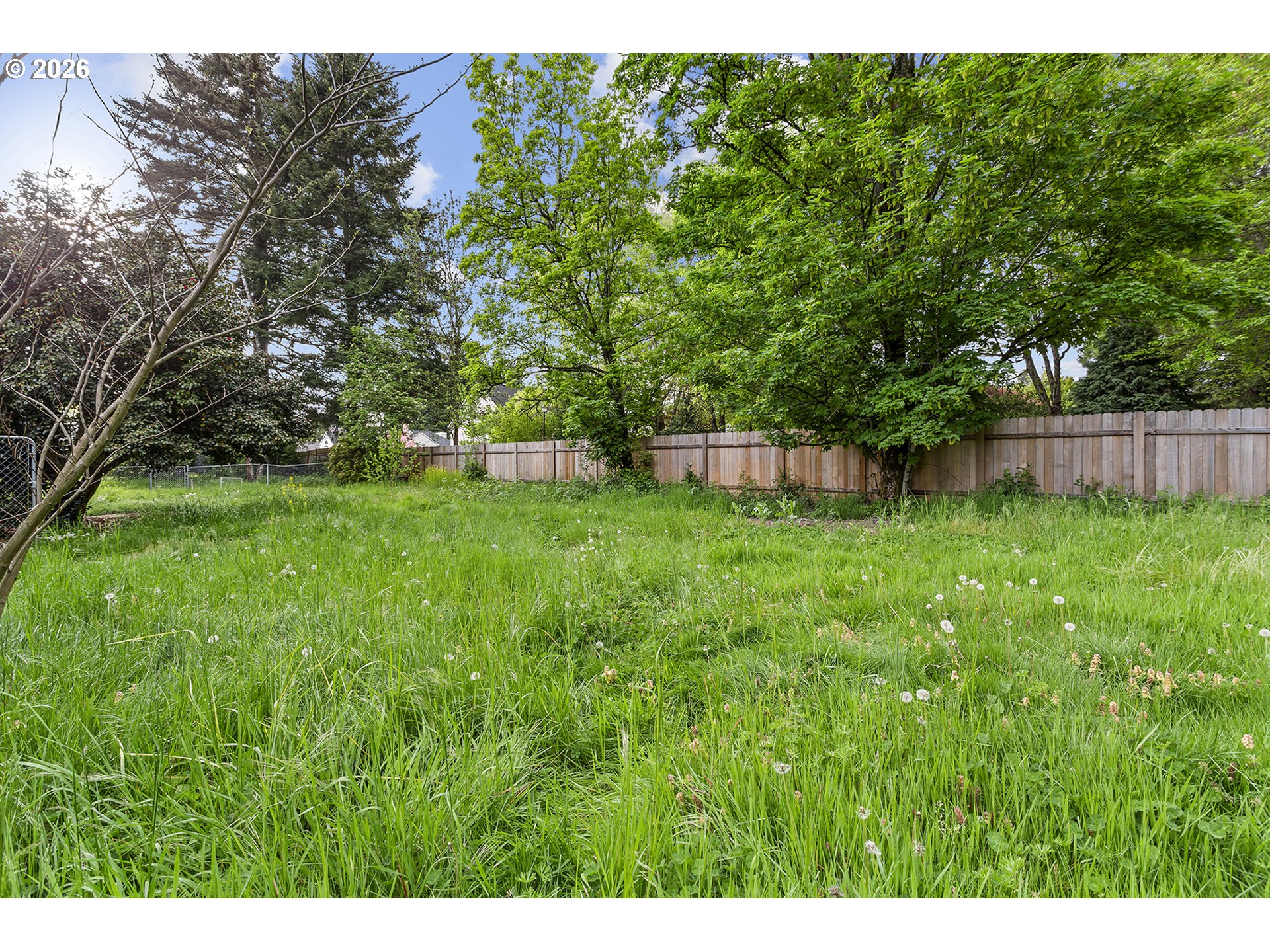 9375 Southwest Killarney Lane Tualatin, OR 97062 - Photo 25 of 25 a backyard of a house with lots of green space