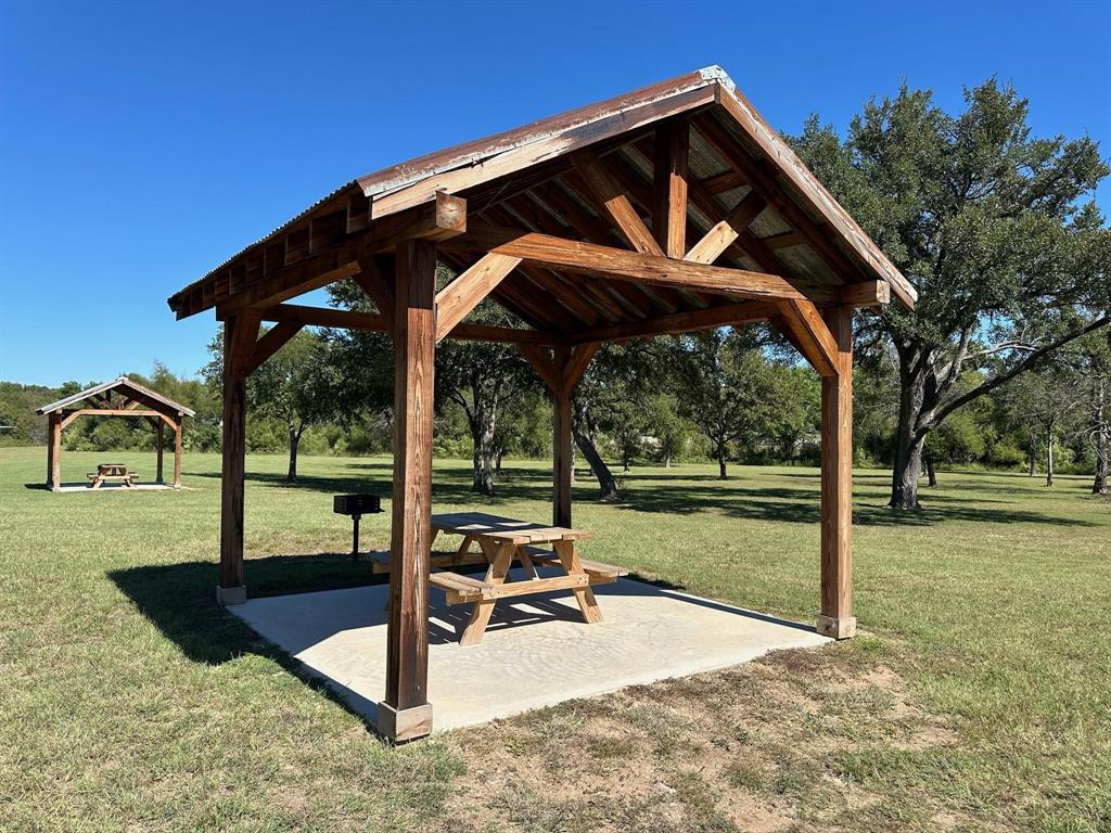 2935 Mattie Ross Road Cresson, TX 76035 - Photo 14 of 23 a view of a wooden deck with a yard