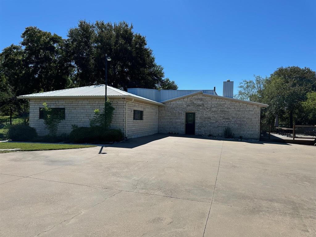 2935 Mattie Ross Road Cresson, TX 76035 - Photo 15 of 23 a house with trees in front of it