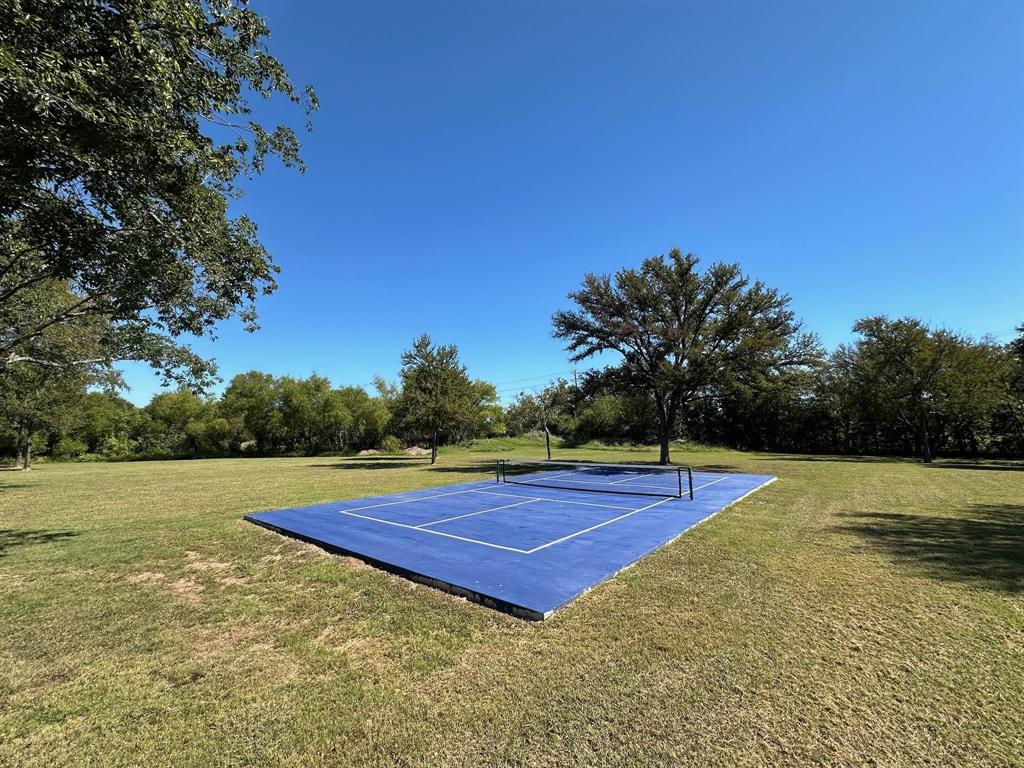 2935 Mattie Ross Road Cresson, TX 76035 - Photo 16 of 23 a view of an outdoor space and tennis court