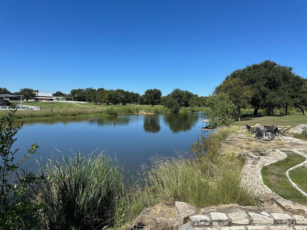 2935 Mattie Ross Road Cresson, TX 76035 - Photo 17 of 23 a view of a lake with houses in the back