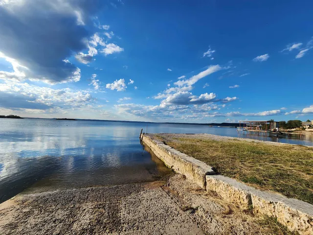 a view of a water an oven and a yard