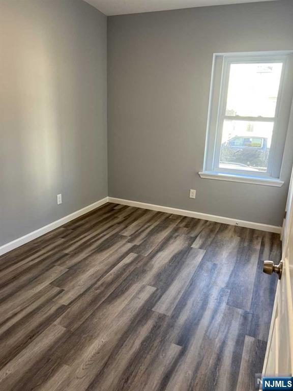 622 Warren Street, Unit 6 Harrison, NJ 07029 - Photo 4 of 5 a view of room with window and hardwood floor