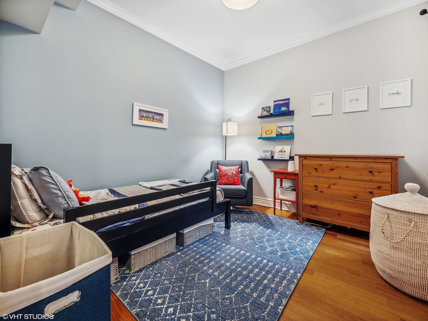 1428 West Irving Park Road, Unit 3 Chicago, IL 60613 - Photo 13 of 18 a bed room with a bed and a chair