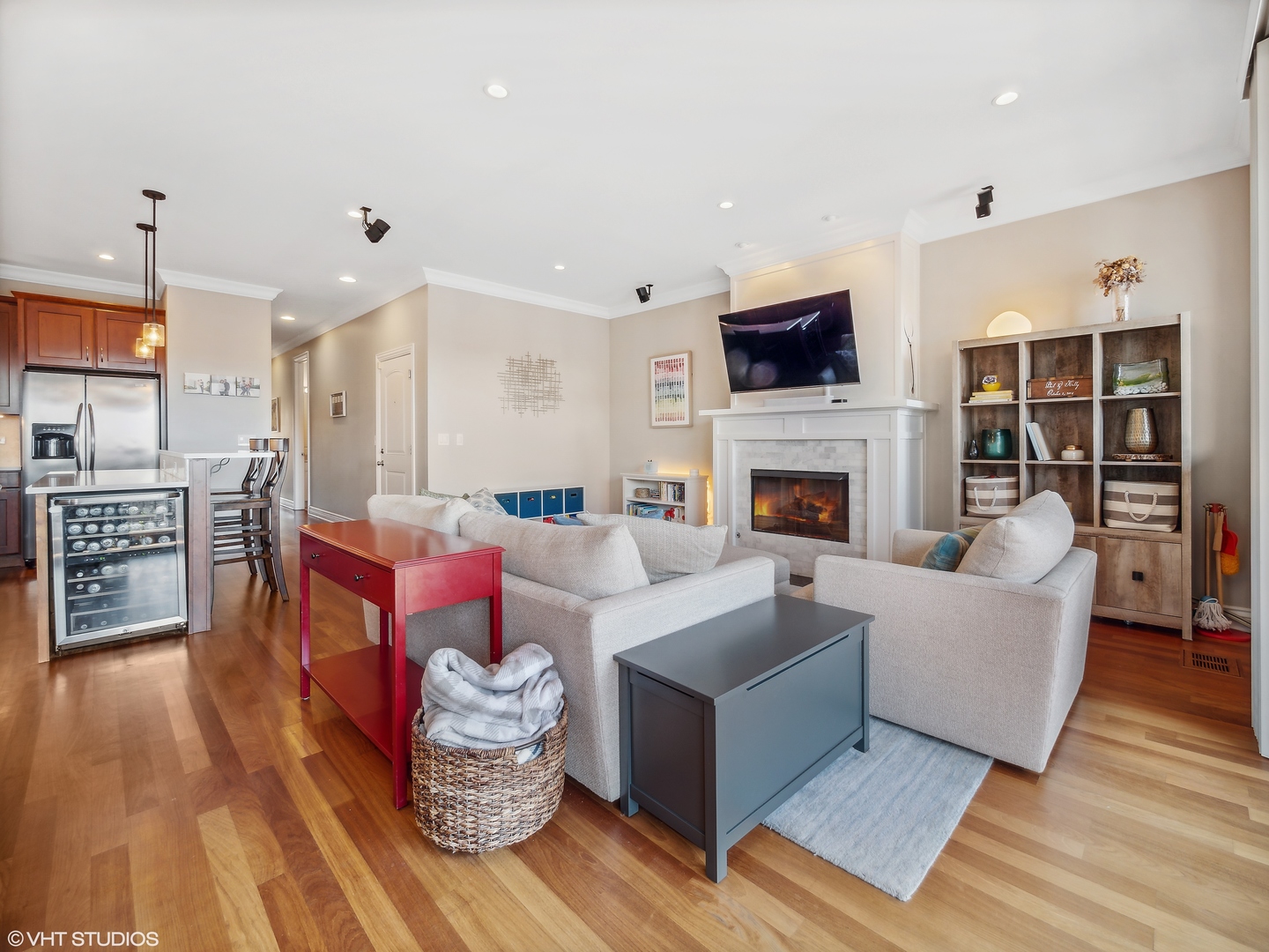 1428 West Irving Park Road, Unit 3 Chicago, IL 60613 - Photo 4 of 18 a living room with fireplace furniture and a flat screen tv