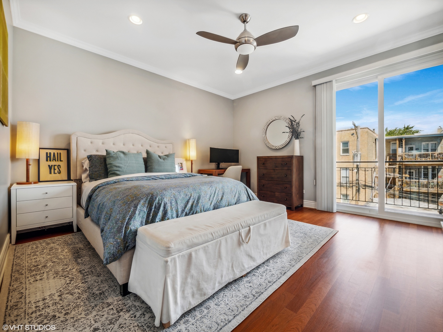 1428 West Irving Park Road, Unit 3 Chicago, IL 60613 - Photo 9 of 18 a bedroom with a large bed and wooden floor