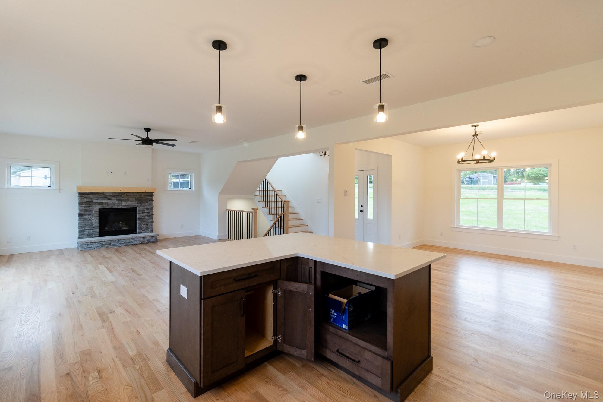 750 Ridgebury Road Slate Hill, NY 10973 - Photo 12 of 41 a kitchen with a stove and a wooden floor