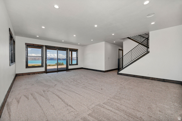 300 Knoll Loop, Unit 227 Fish Haven, ID 83287 - Photo 26 of 56 Unfurnished living room featuring light carpet and recessed lighting