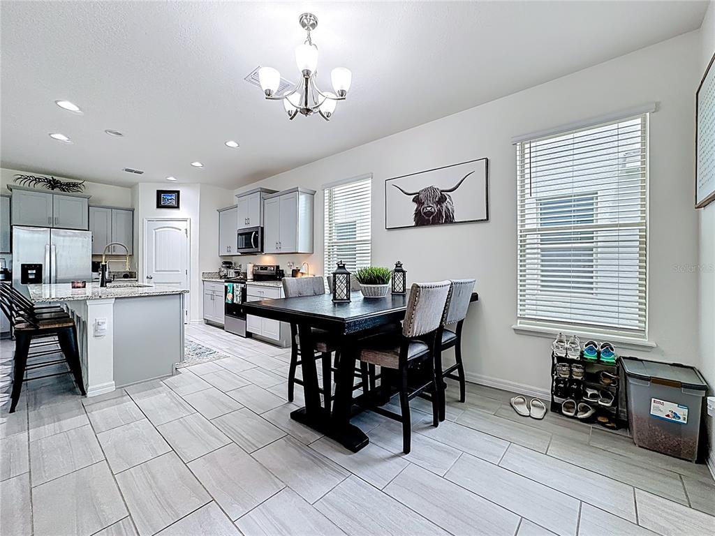16632 Point Rock Drive Winter Garden, FL 34787 - Photo 22 of 74 a view of a dining room with furniture and chandelier