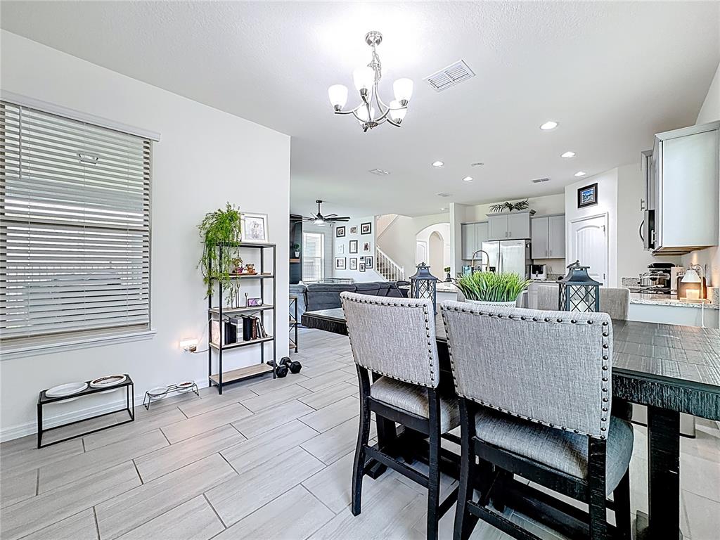 16632 Point Rock Drive Winter Garden, FL 34787 - Photo 23 of 74 a dining room with furniture and window
