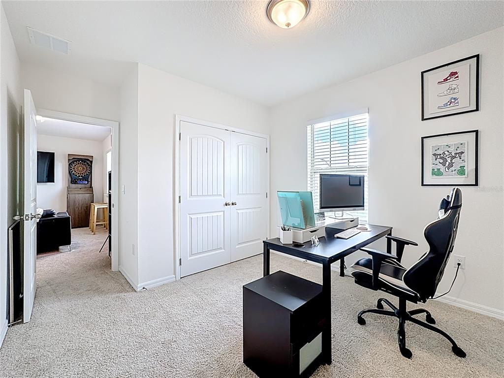 16632 Point Rock Drive Winter Garden, FL 34787 - Photo 25 of 74 a view of a livingroom with workspace and a couch