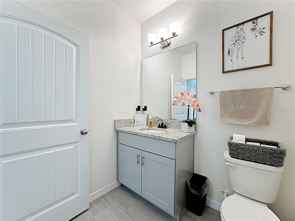 16632 Point Rock Drive Winter Garden, FL 34787 - Photo 28 of 74 a bathroom with a toilet sink and mirror