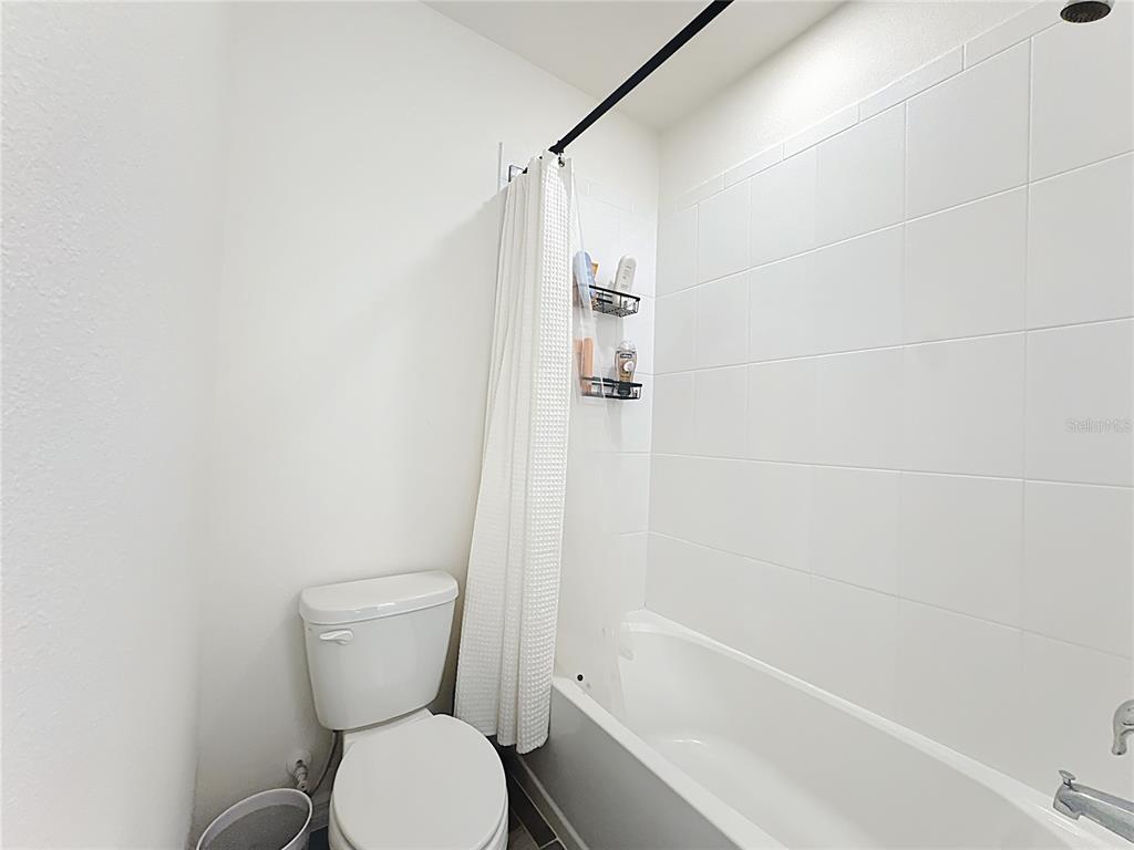 16632 Point Rock Drive Winter Garden, FL 34787 - Photo 33 of 74 a white toilet sitting next to a bath tub