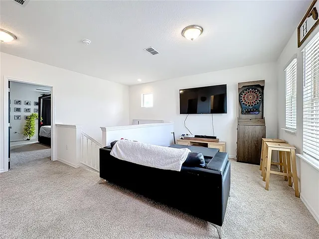 an aerial view of a house with a garden and a yard