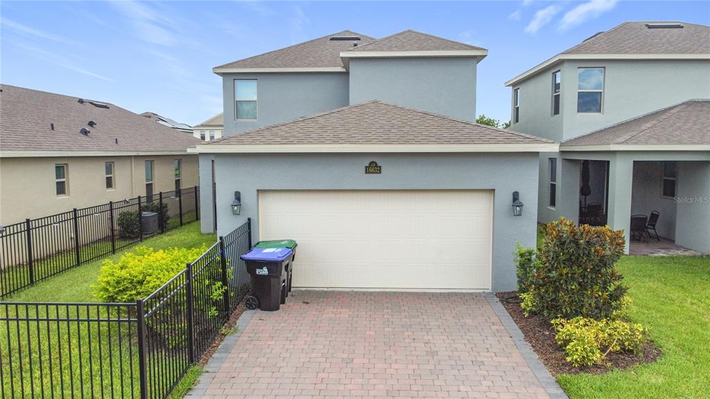 16632 Point Rock Drive Winter Garden, FL 34787 - Photo 62 of 74 a front view of a house with garden