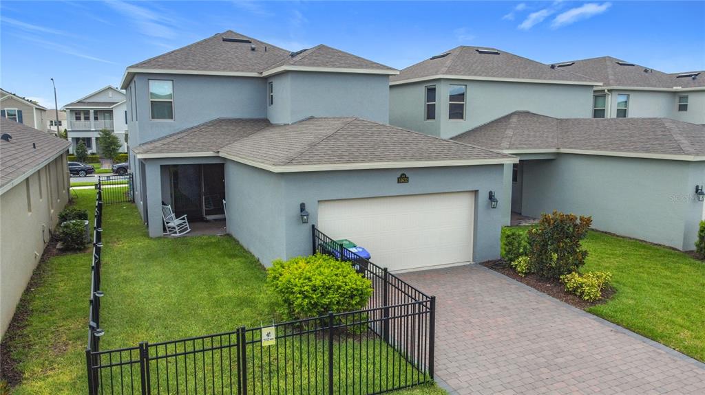 16632 Point Rock Drive Winter Garden, FL 34787 - Photo 63 of 74 a front view of house with yard and green space