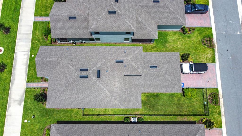 16632 Point Rock Drive Winter Garden, FL 34787 - Photo 65 of 74 an aerial view of a house with a garden and a yard