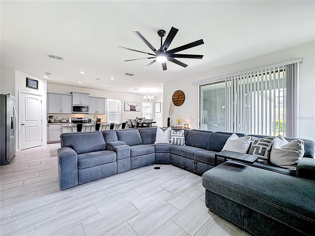 16632 Point Rock Drive Winter Garden, FL 34787 - Photo 8 of 74 a living room with furniture and a large window