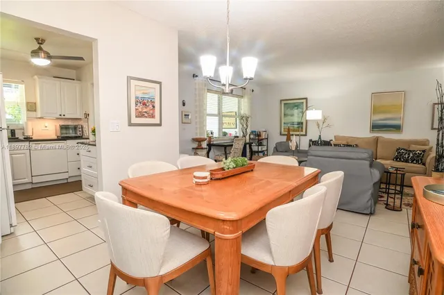 a bathroom with a shower sink vanity mirror and toilet