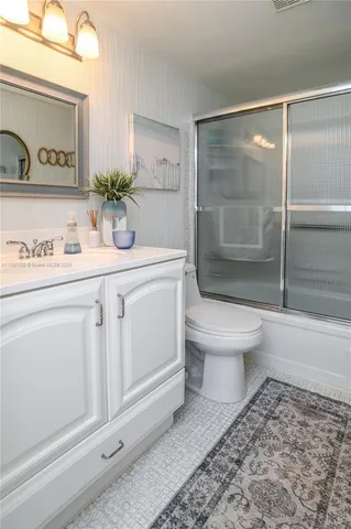 a bedroom with a bed dresser and a chair