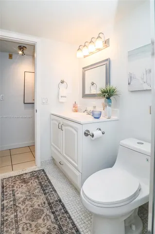 a bedroom with bed and flat screen tv