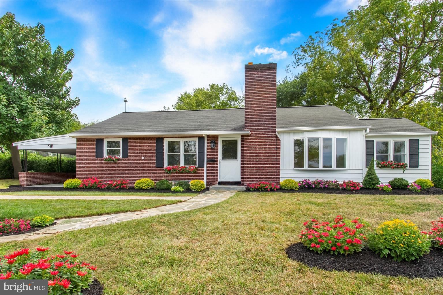 22 Rita Marie Avenue Littlestown, PA 17340 - Photo 1 of 34 a front view of a house with a yard and garage