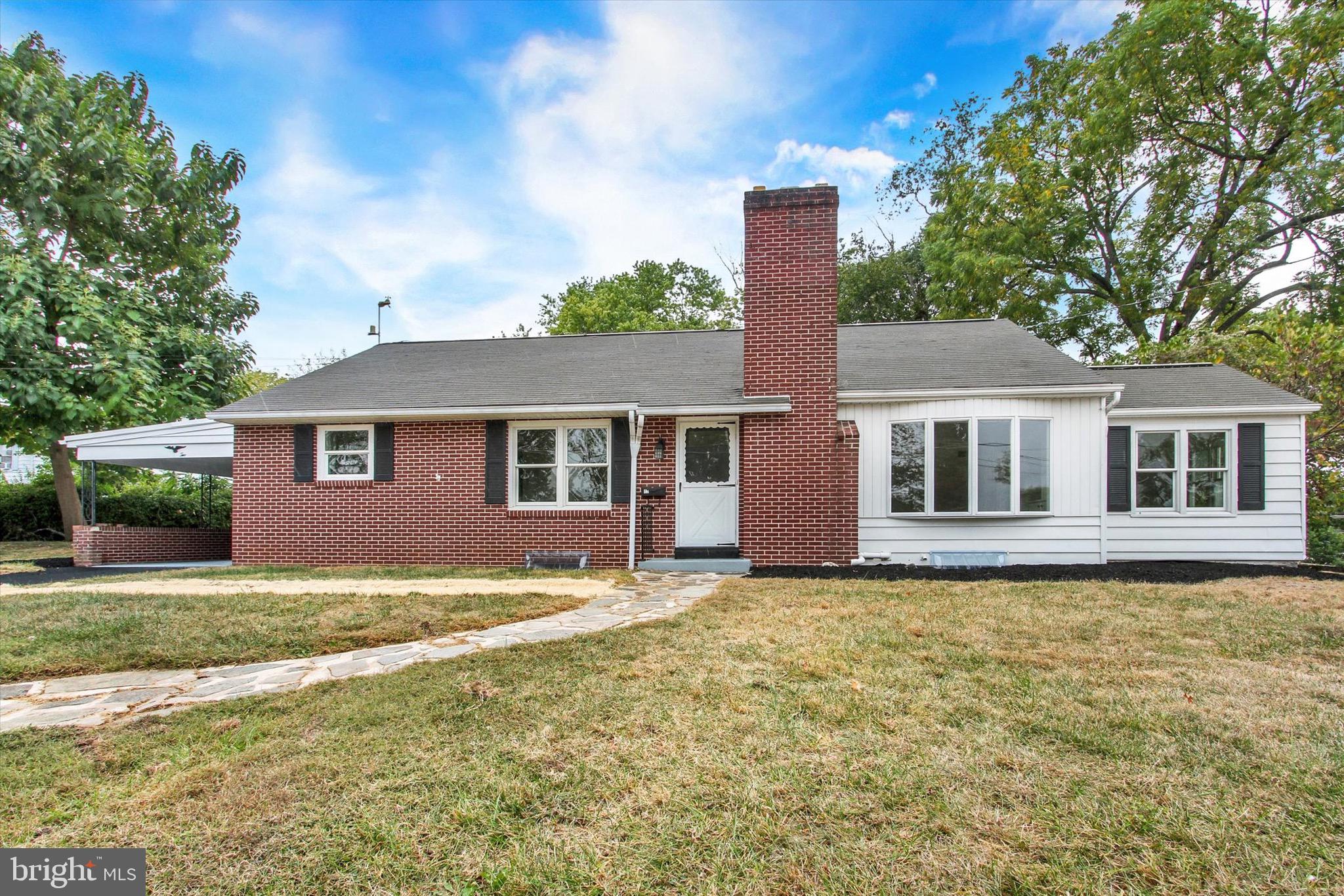 22 Rita Marie Avenue Littlestown, PA 17340 - Photo 2 of 34 a view of a yard in front of a house with a large tree