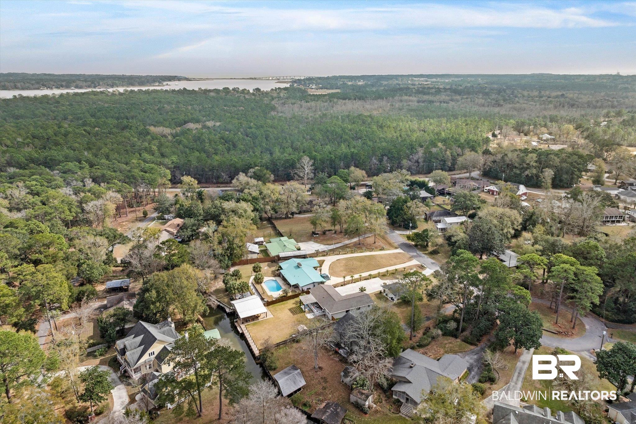 3720 Rabbit Creek Court Theodore, AL 36582 - Photo 44 of 47 Aerial view of property and surrounding area featuring a heavily wooded area and nearby suburban area