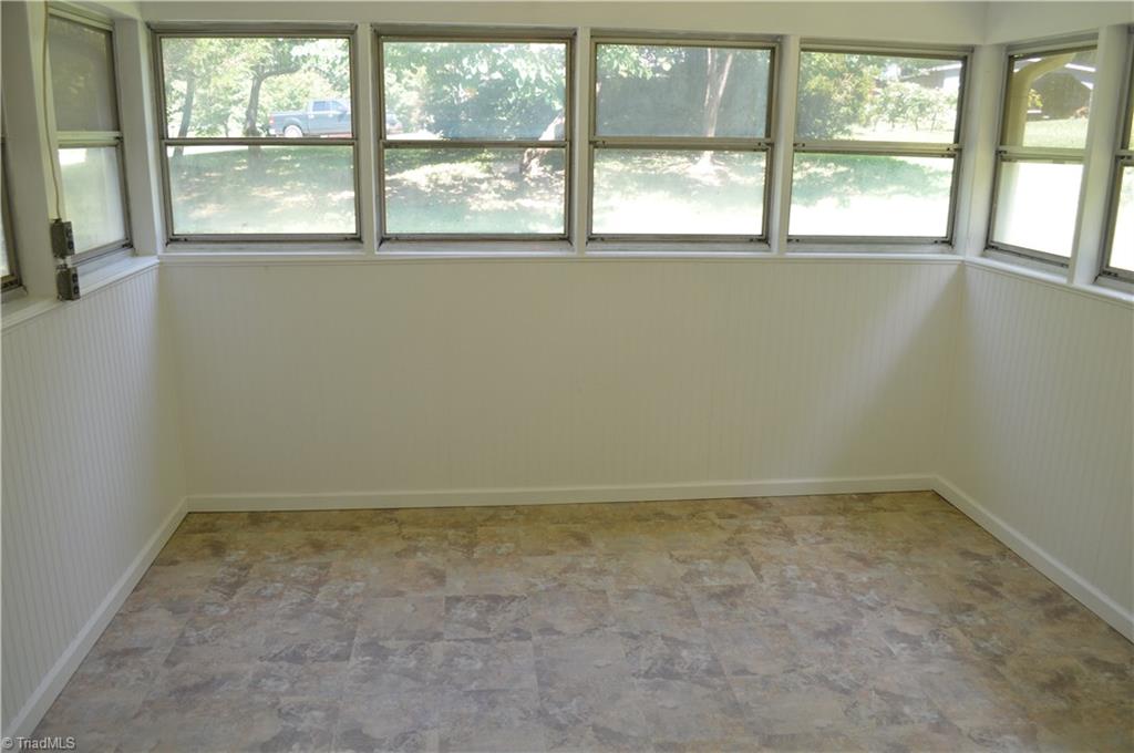 7229 Alcorn Road Greensboro, NC 27409 - Photo 9 of 13 Enclosed heated porch. Electric baseboard heat.