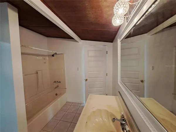 a bathroom with a bathtub and shower
