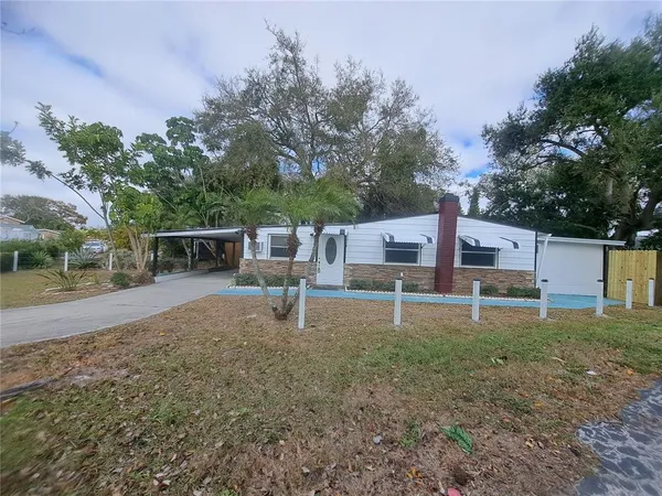 a house view with a backyard space